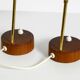 A pair of mid-century modern bedside lamps with perforated metal shades