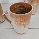 Set of 5 vintage handcrafted stoneware mugs in beige, pink, and white glazed stoneware