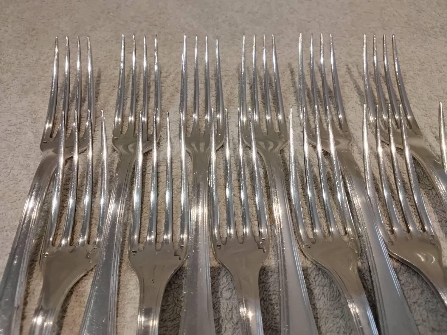 12 silver-plated table forks by Christofle America