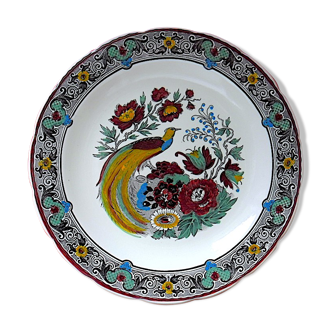 Plat circulaire en faïence polychrome à décor ornithologique