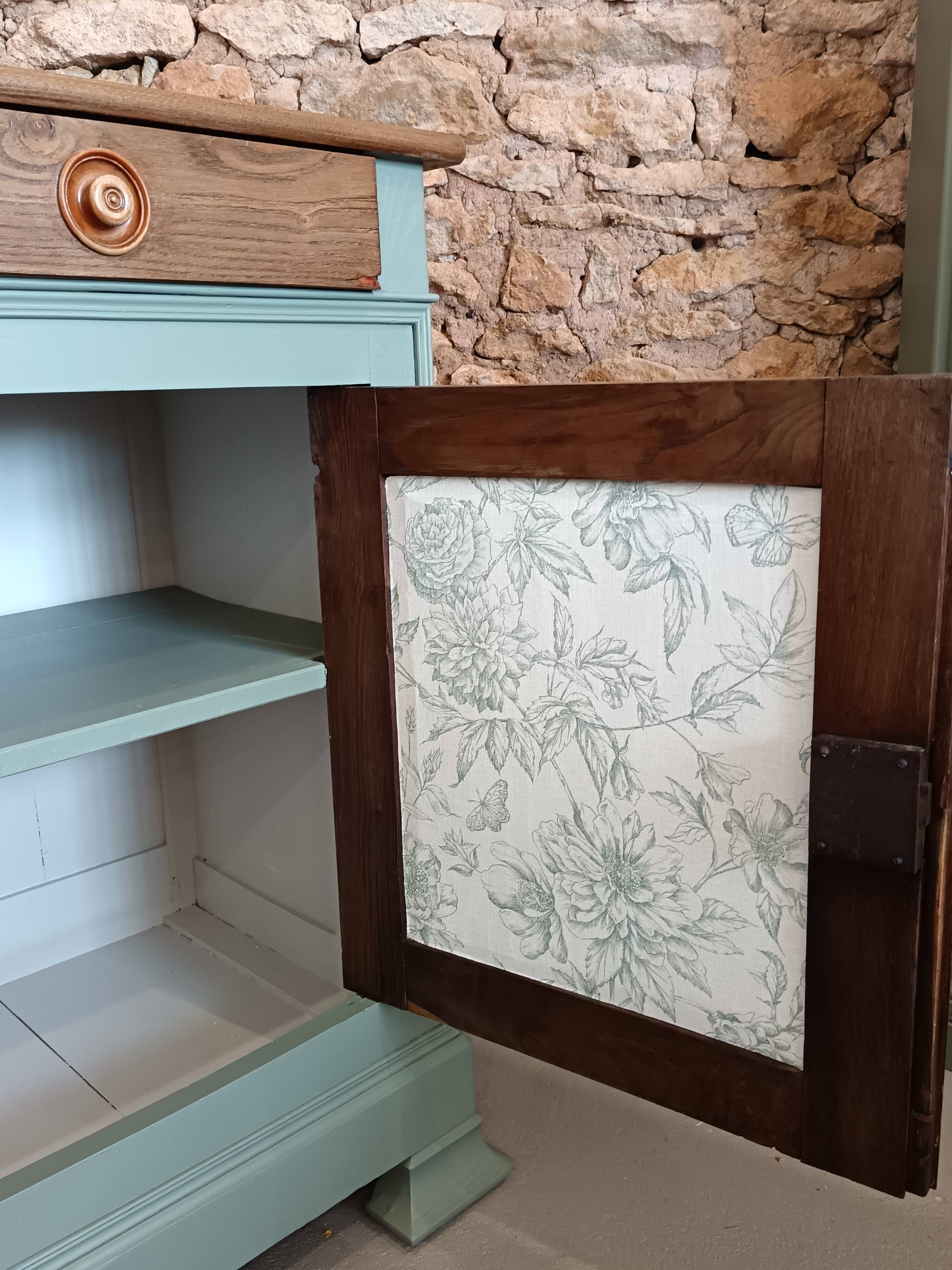 Buffet made of natural wood and bronze green.