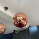 Copper Tom Dixon pendant lights individually