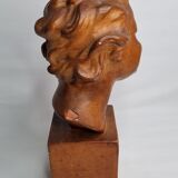 Bust of a laughing child in patinated plaster, 35 cm