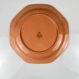Octagonal plate in salmon pink, iron earth, Pagnossin, Italy, 20th century.