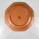 Octagonal plate in salmon pink, iron earth, Pagnossin, Italy, 20th century.