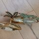 Gold metal wall light with light blue tassels