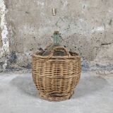 Demijohn with her basket