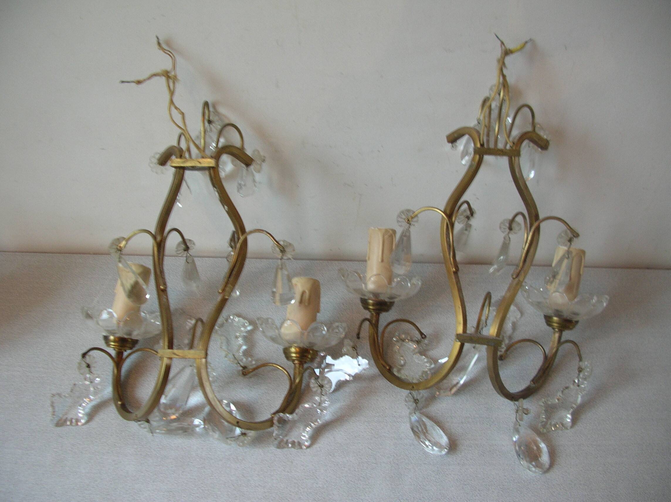 Old pair of double lamp lights with glass and brass pendants, retro decoration