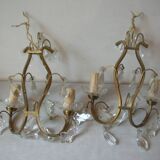 Old pair of double lamp lights with glass and brass pendants, retro decoration