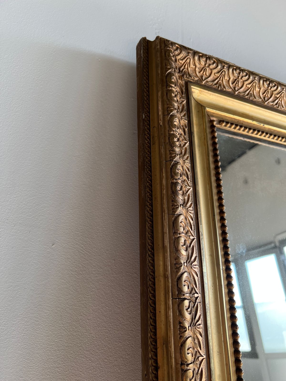 Gilded mirror with frieze h2m10 l:73cm