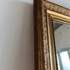 Gilded mirror with frieze h2m10 l:73cm