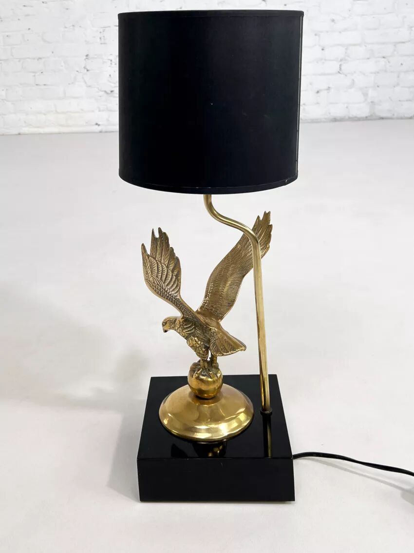 Brass lamp on black lacquered wooden base
