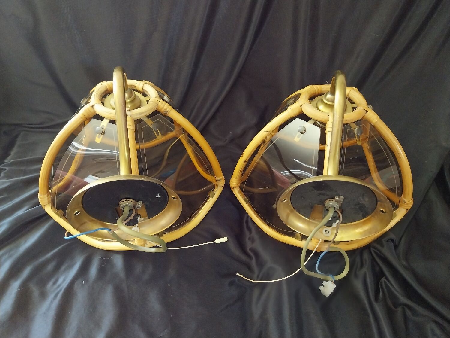 Wall sconces in rattan and smoked glass