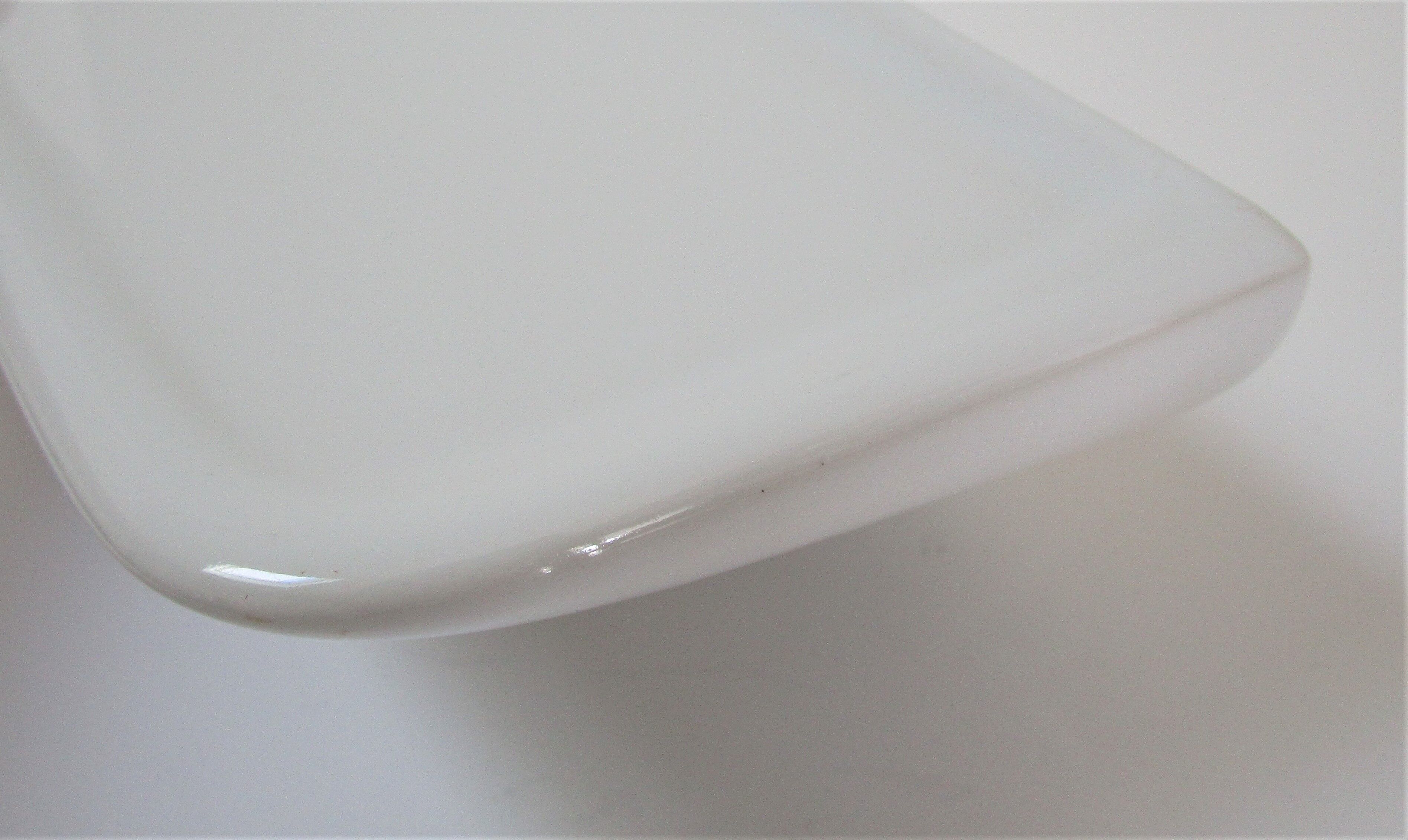 Vintage white enamelled ceramic wall shelf