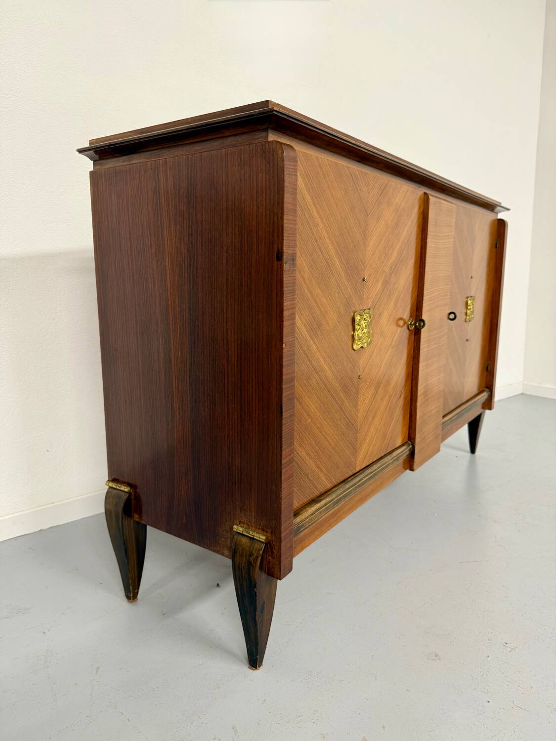 Antique art deco sideboard from the 1930s with veneered wood and bronze insert