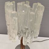 Table lamp with a teak ‘trunk’, silver-coloured metal base, acrylic shade