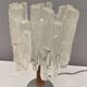 Table lamp with a teak ‘trunk’, silver-coloured metal base, acrylic shade