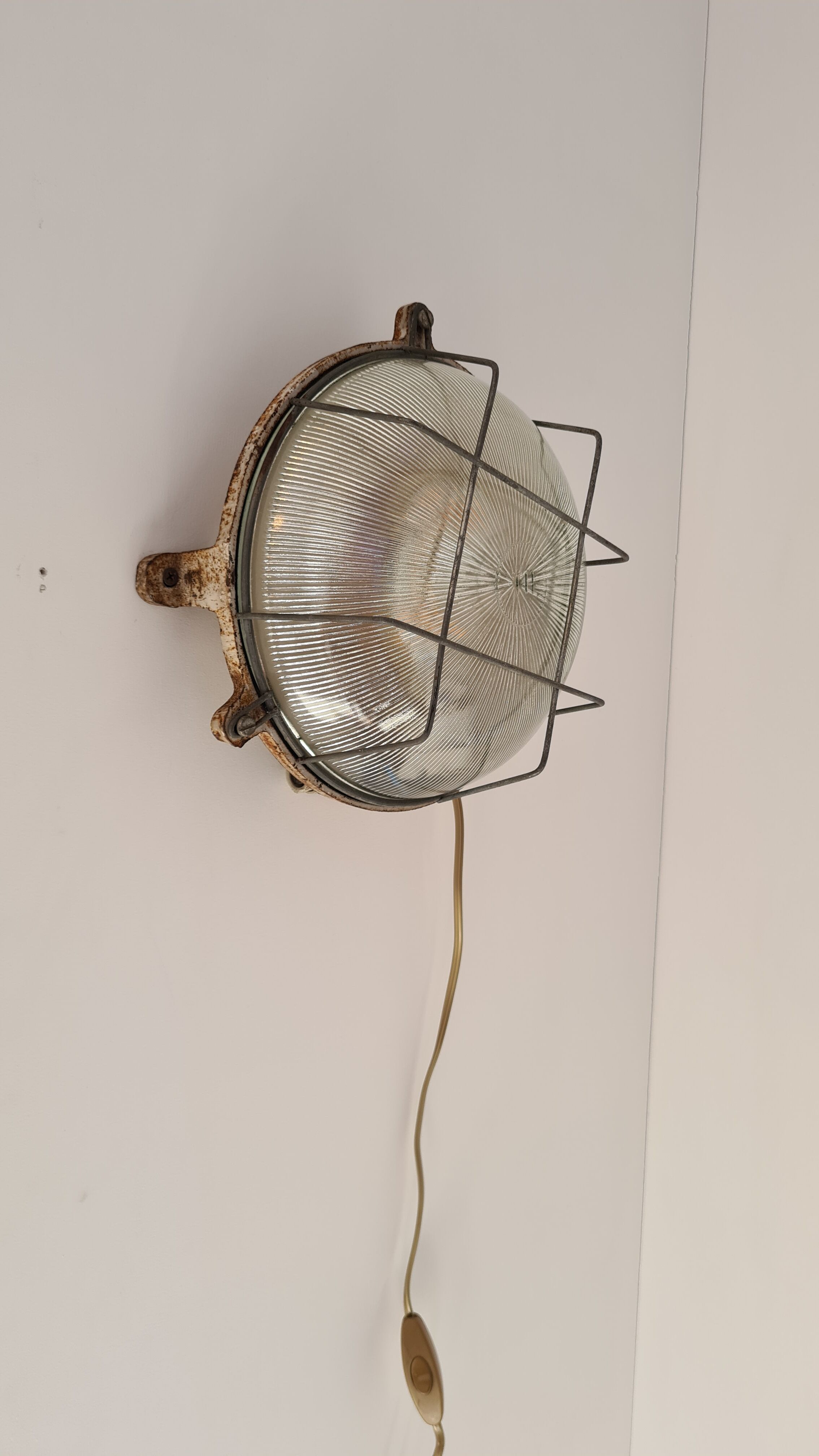 Cast iron porthole wall lamp by TH