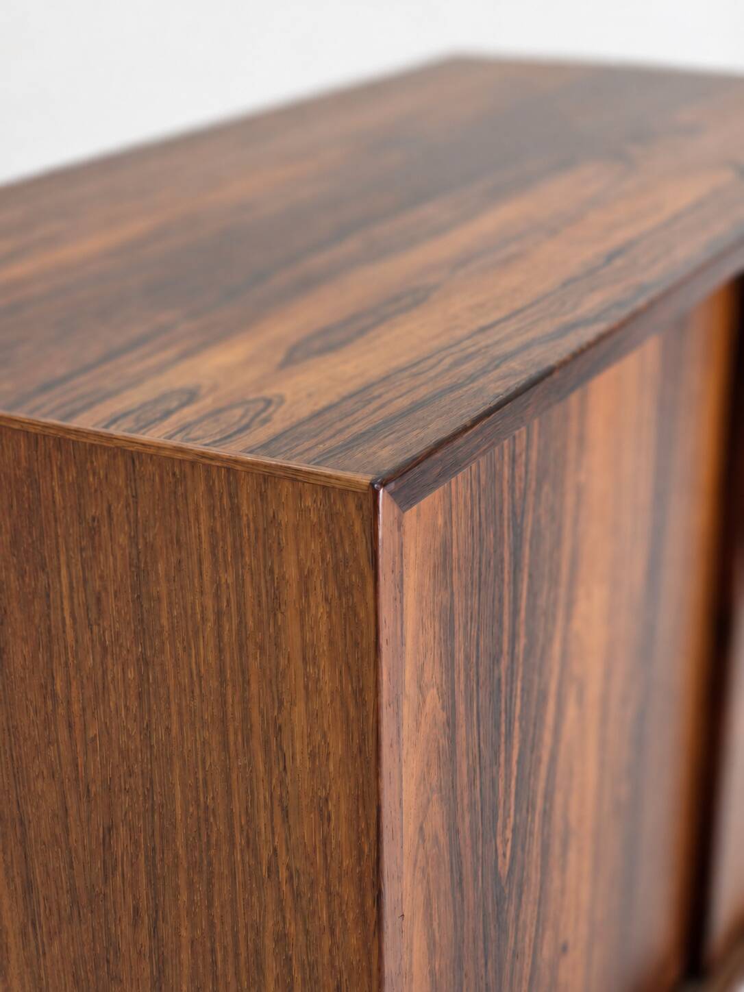 Low sideboard in rosewood with sliding doors. Denmark, 1960s