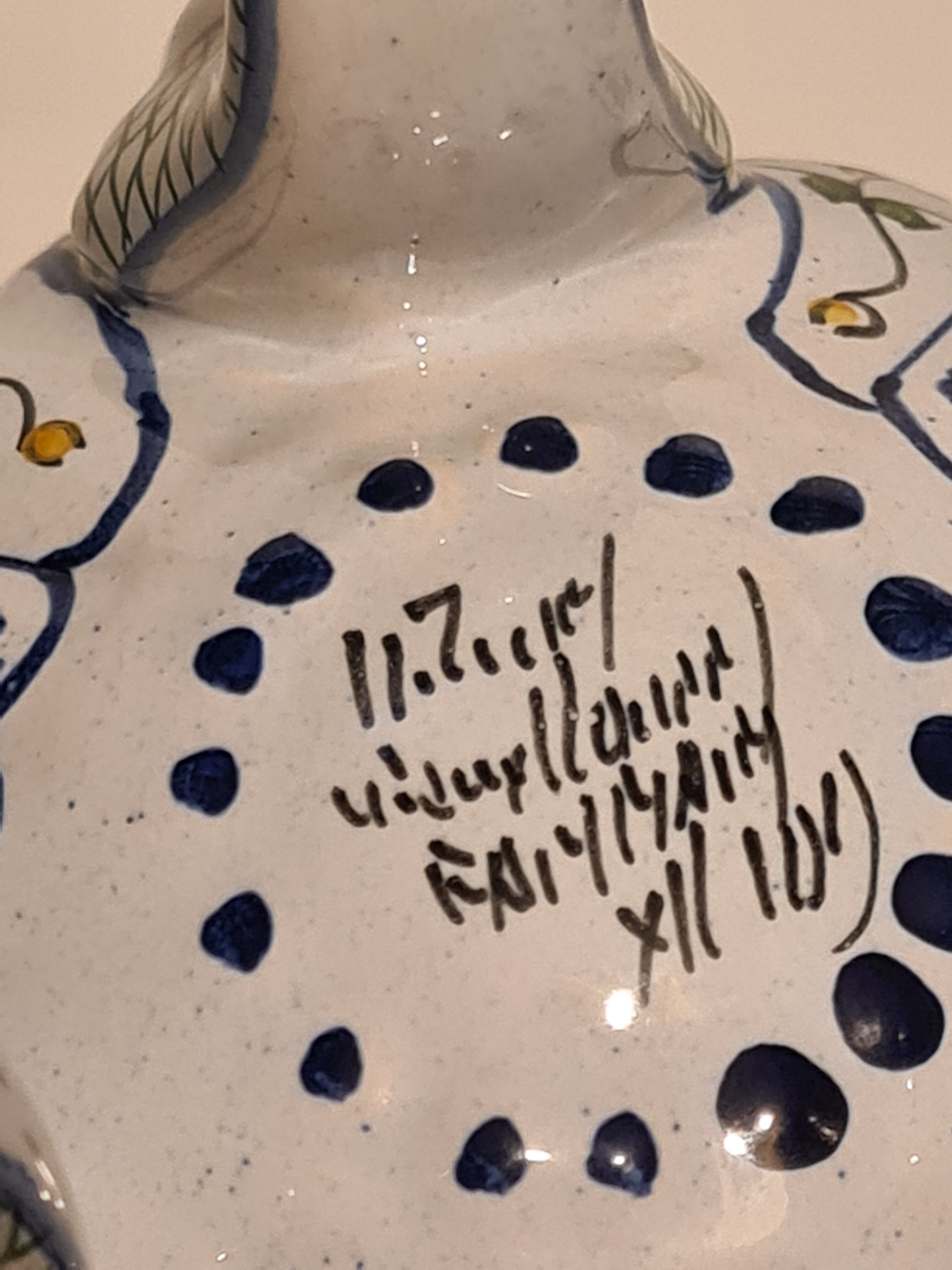 Earthenware tripod vase of Nevers floral decoration