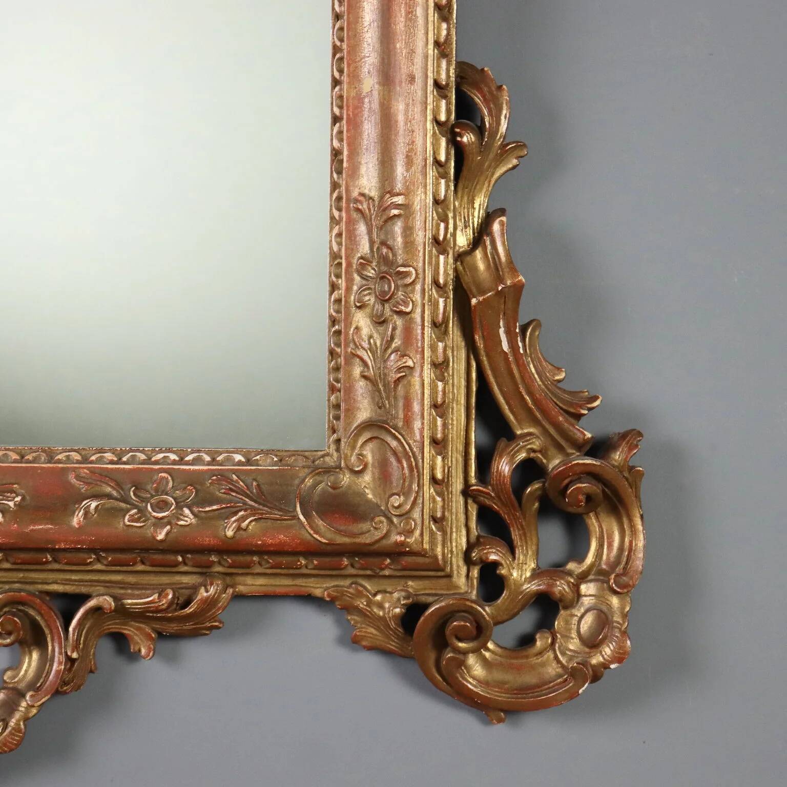 Antique carved and gilded wooden mirror, Italy, early 20th century.