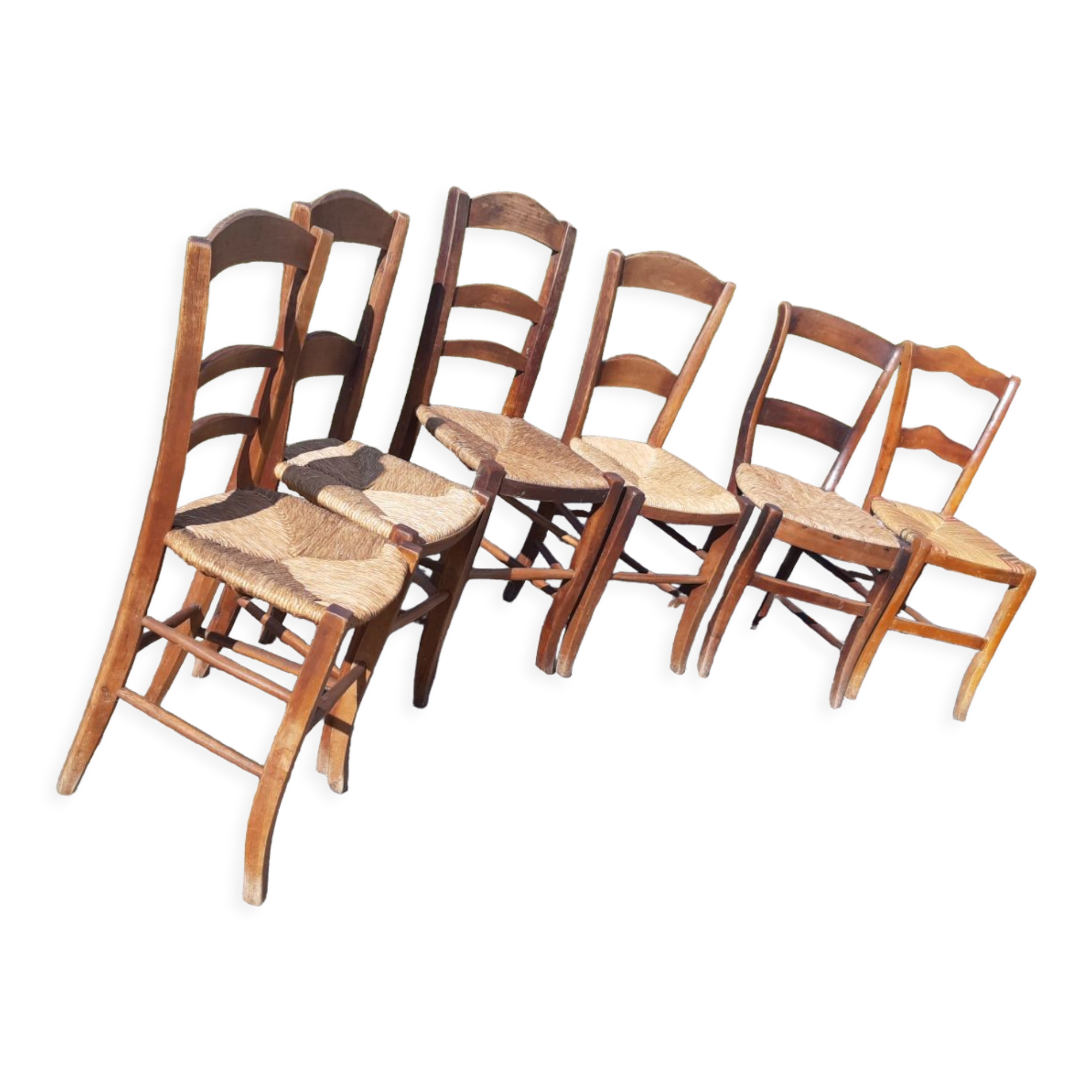 6 antique and mismatched mulched chairs