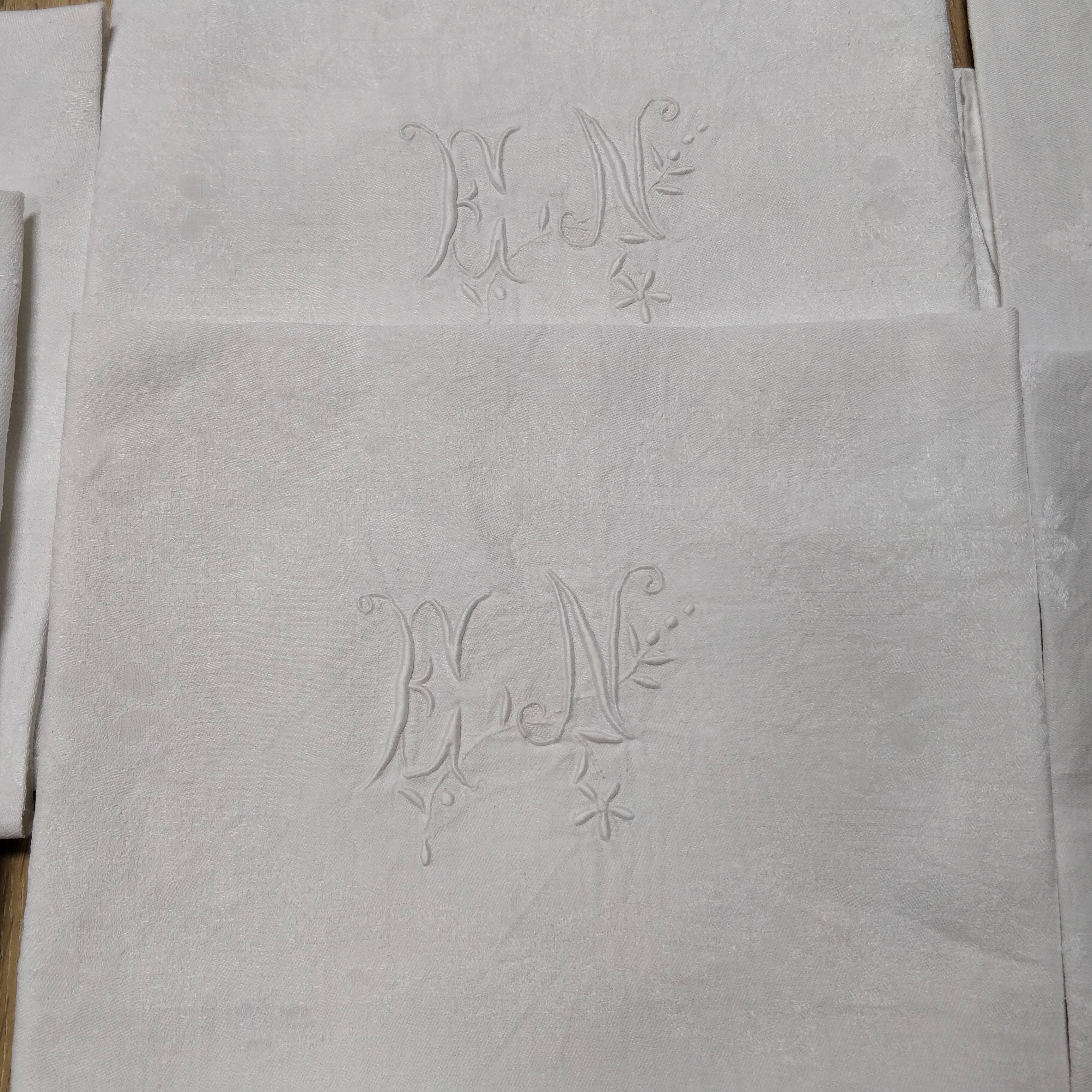 White linen towels embroidered
