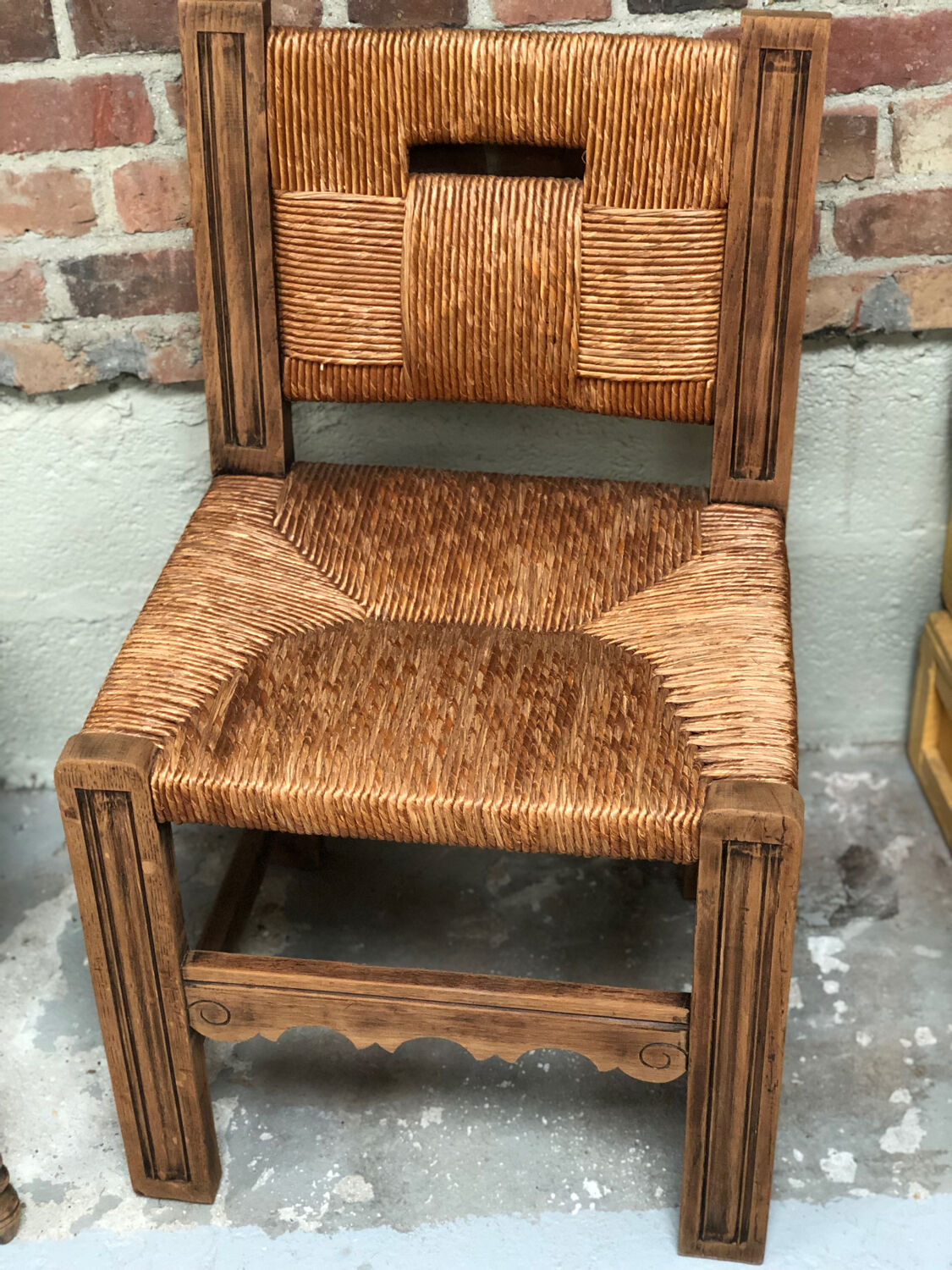 Old straw brutalist chair