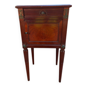 Elegant antique bedside table in the Louis XVI style, made of mahogany and mahogany veneer.