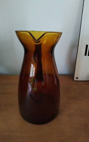 Vintage pitcher in amber glass