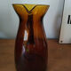 Vintage pitcher in amber glass