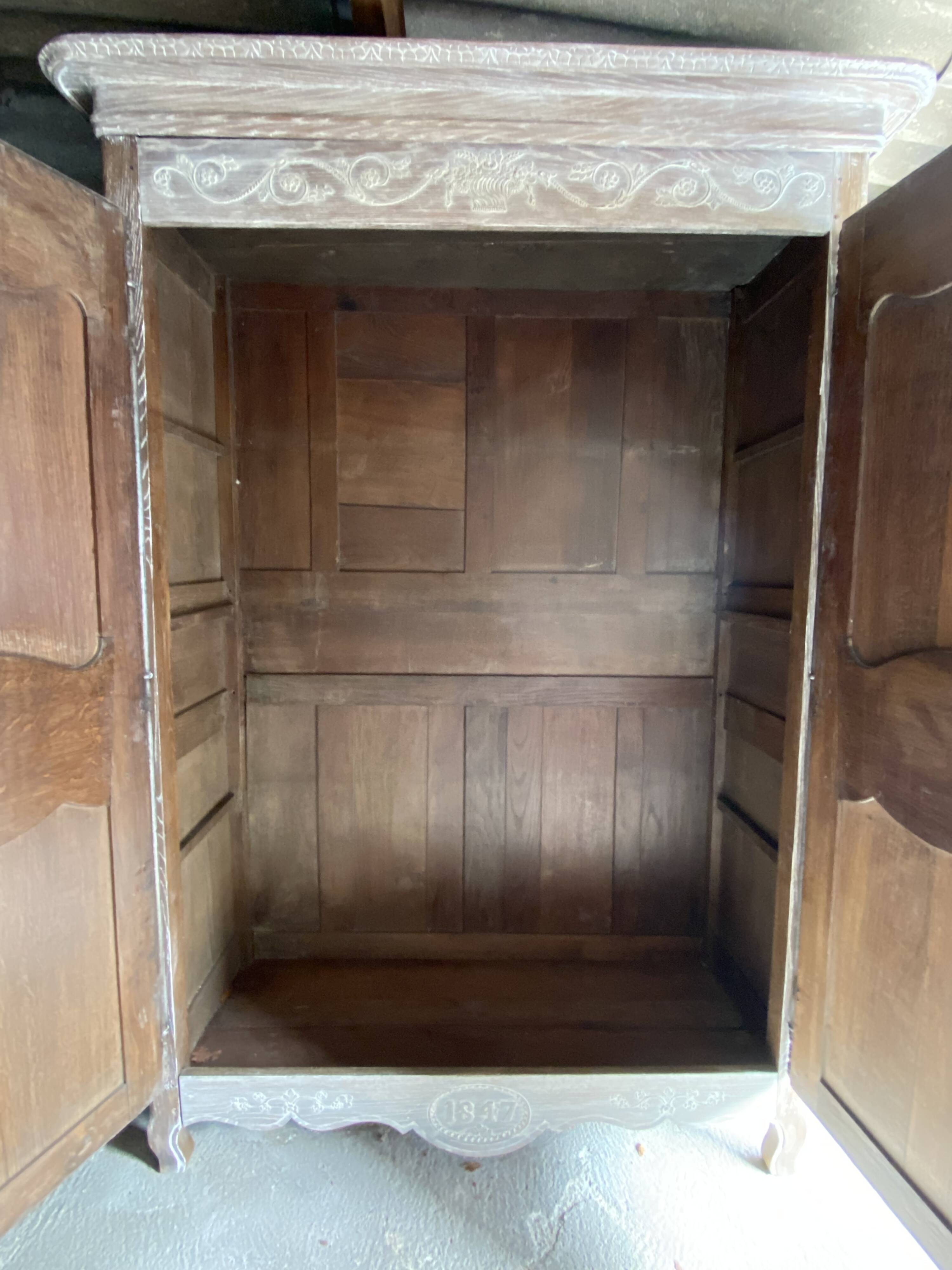 19th century limed oak wardrobe.