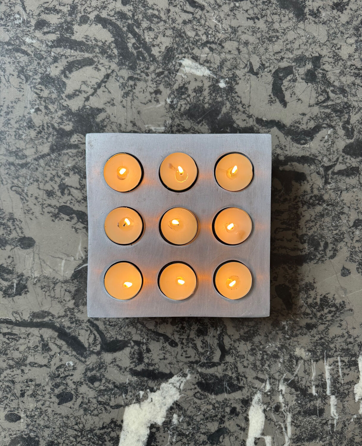 Brutalist style brushed aluminum candle holder