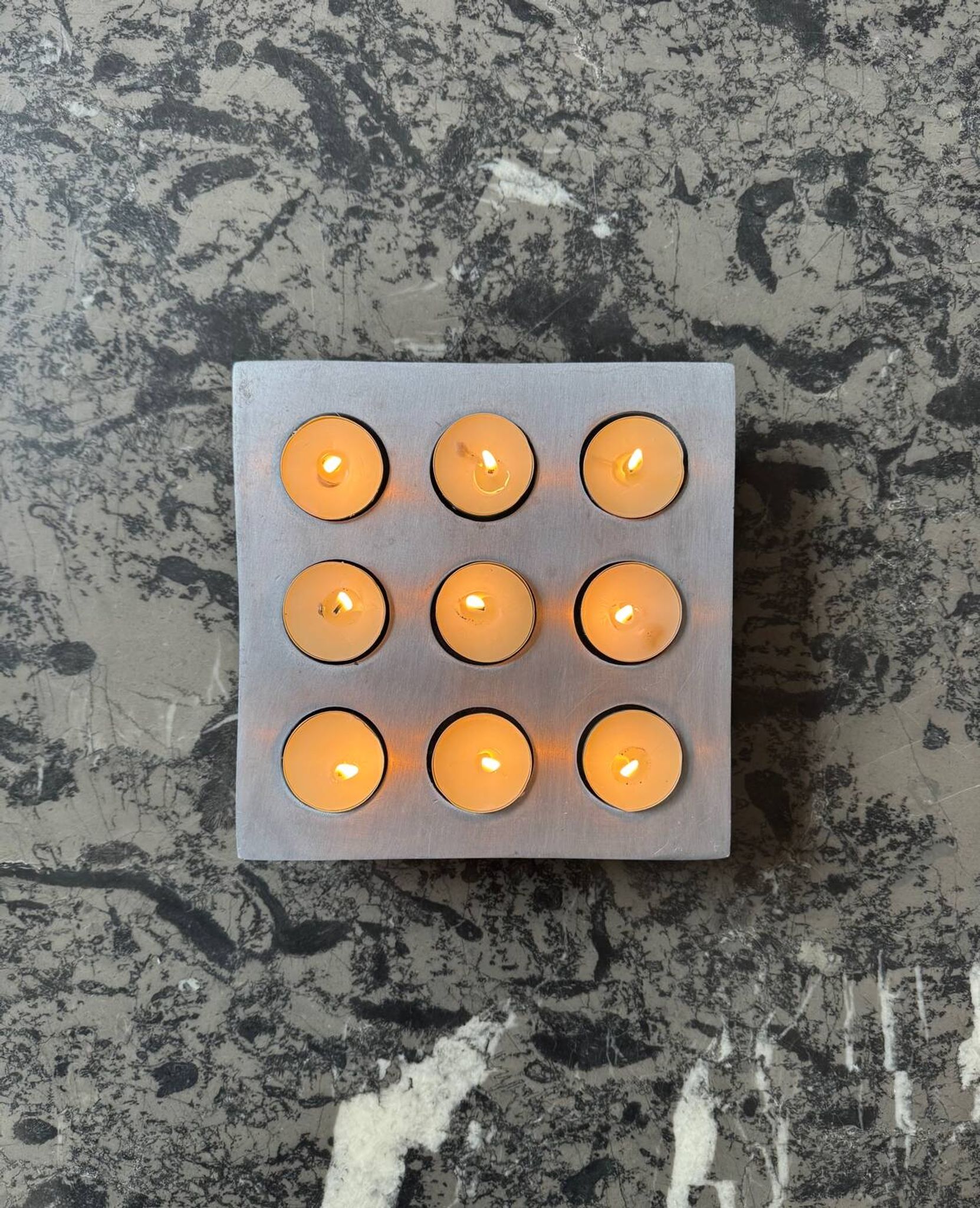 Brutalist style brushed aluminum candle holder