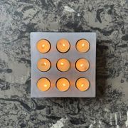 Brutalist style brushed aluminum candle holder