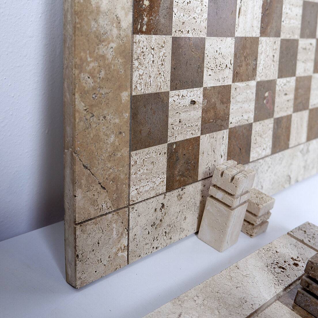 Modernist two-tone travertine chess set, Italy, 1970s