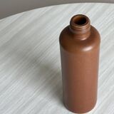 Decorative brown ceramic bottle.