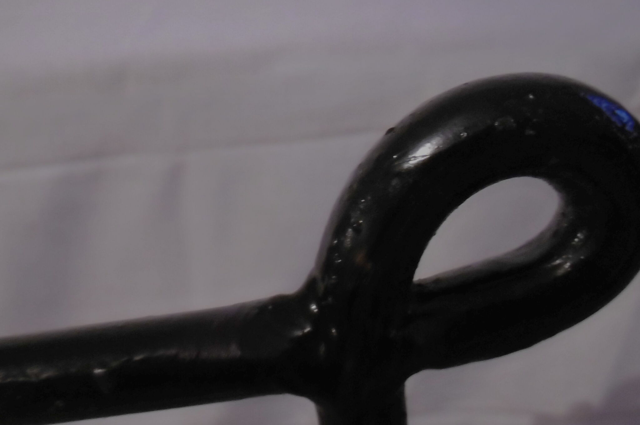 Black metal and rattan bed frame