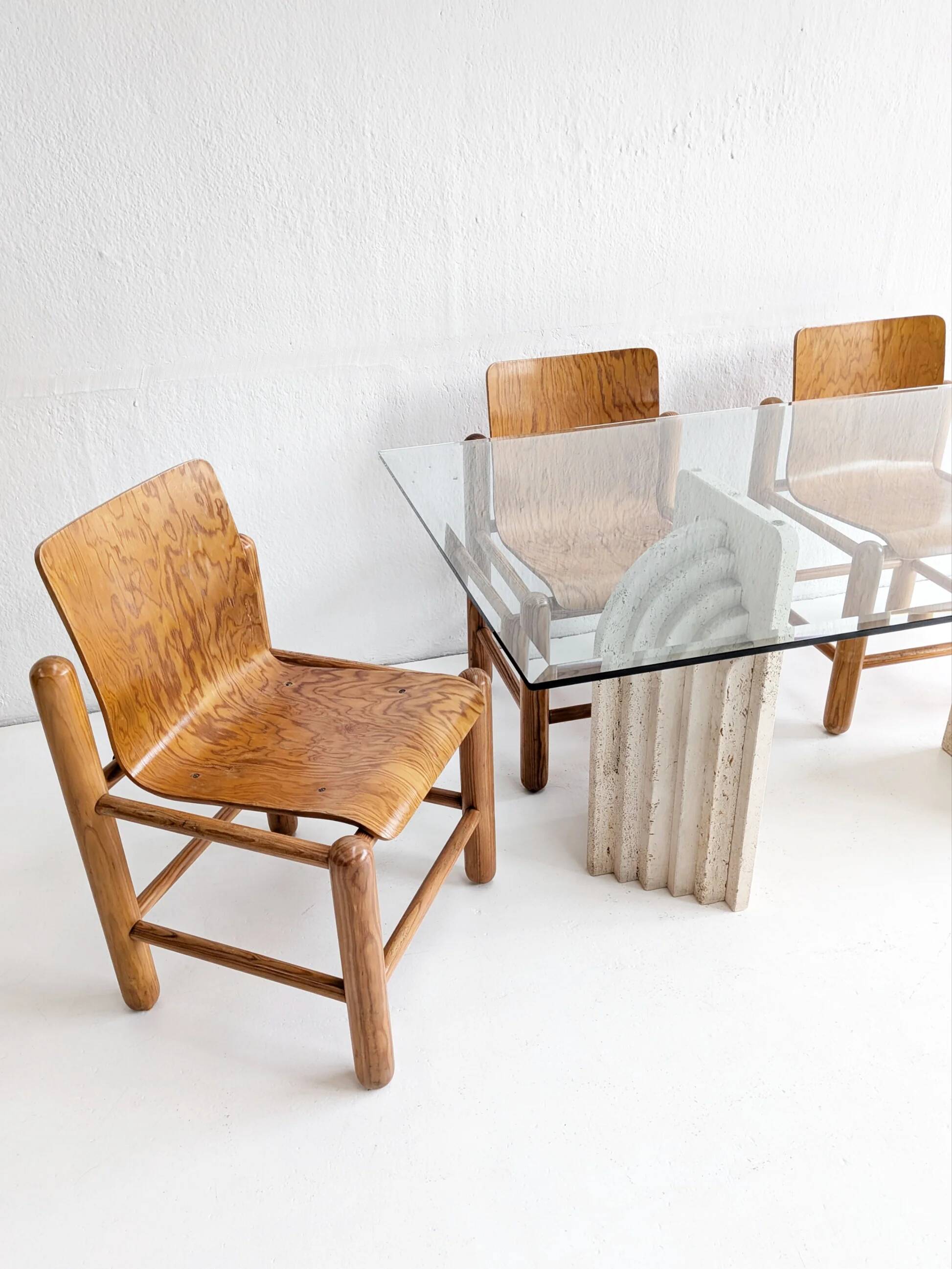 Dining table in travertine and glass with sculpted legs, 1970s.
