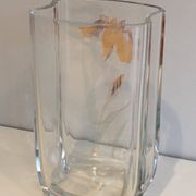 Glass vase with a decoration of a golden flower, around 1970.