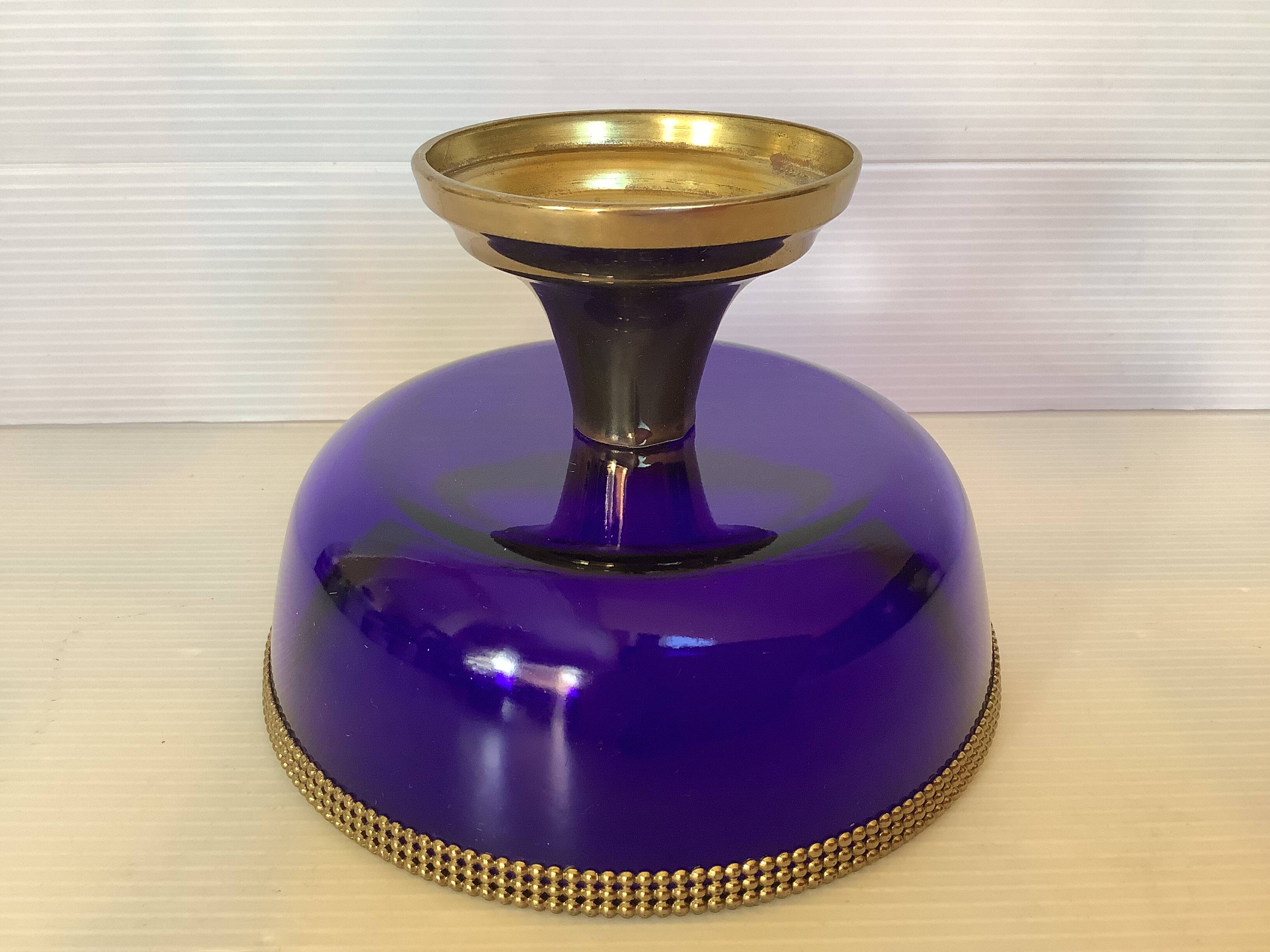 Cobalt blue trinket dish with a beaded pattern.