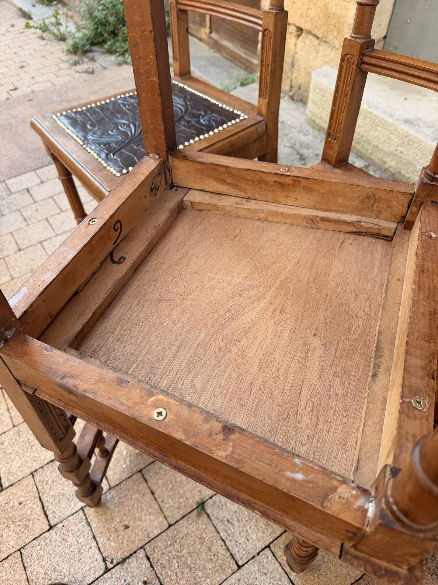 Set of 6 antique turned wooden chairs with embossed leather seats.
