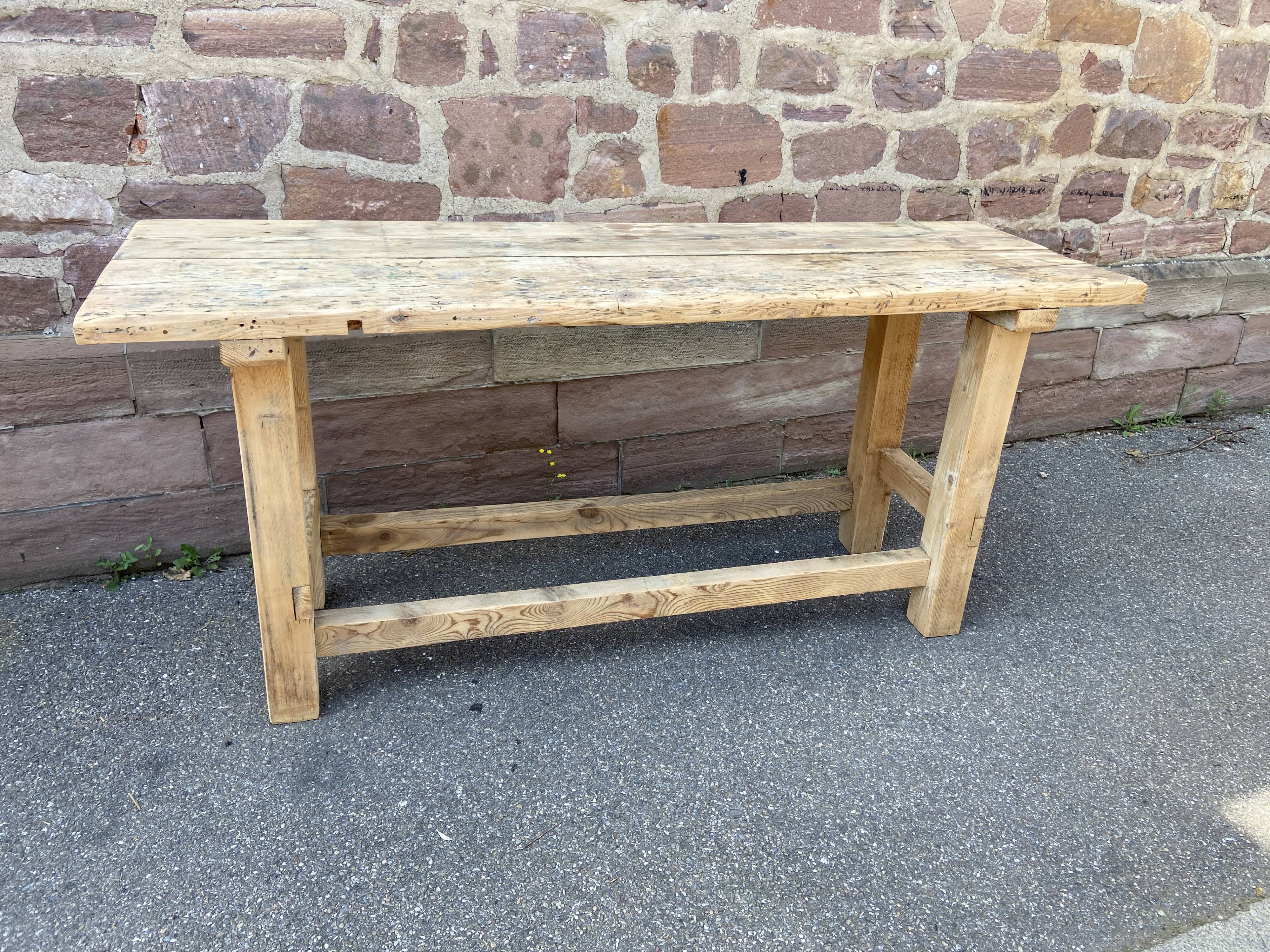 Primitive industrial table workbench in raw natural wood vintage bohemian trade store
