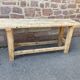 Primitive industrial table workbench in raw natural wood vintage bohemian trade store