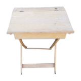 Children's desk with crossed legs