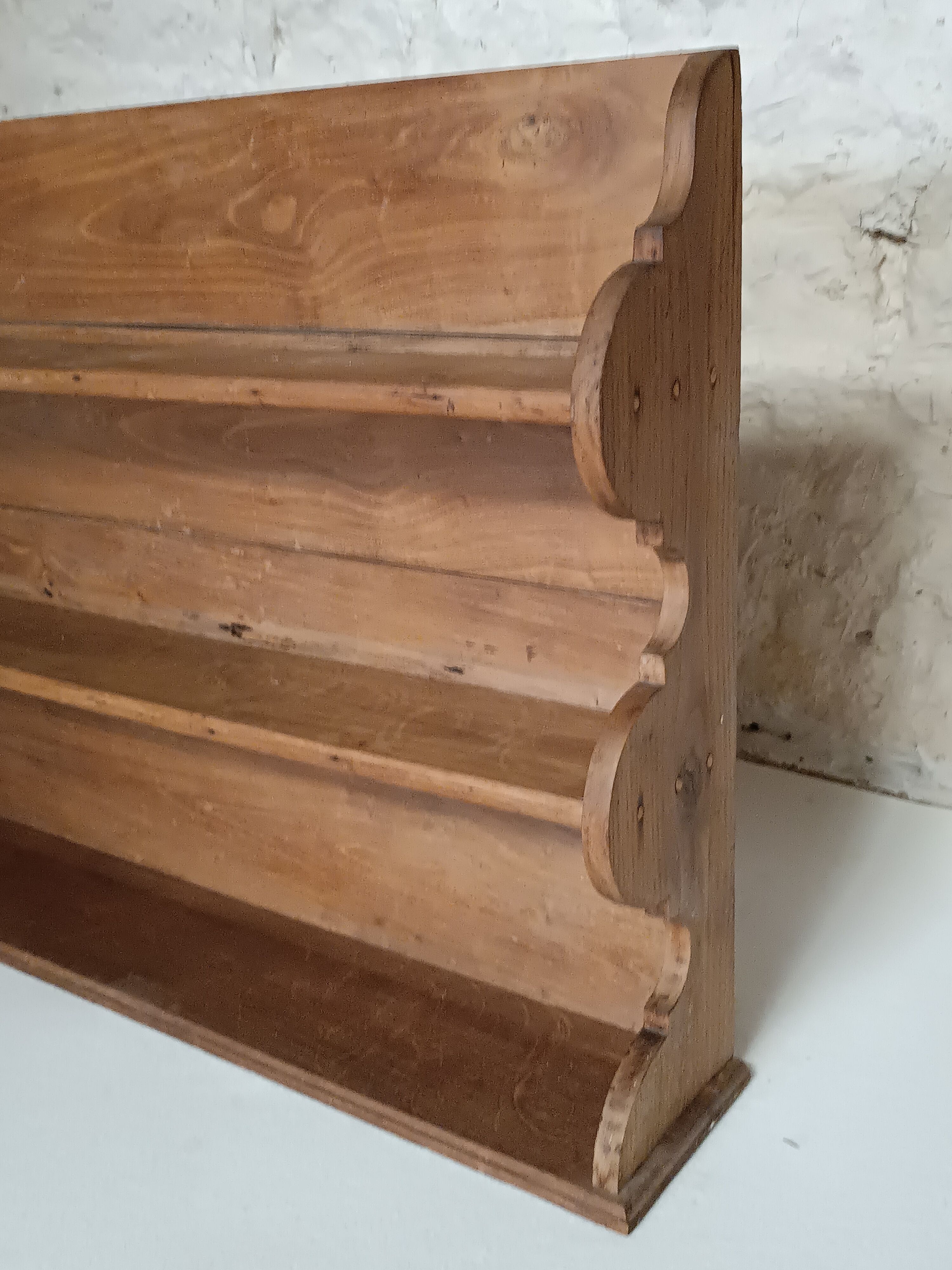 Old wall shelf in raw wood
