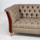 Chesterfield sofa in leather, fabric and wood
