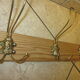 old coat rack with 5 metal hooks