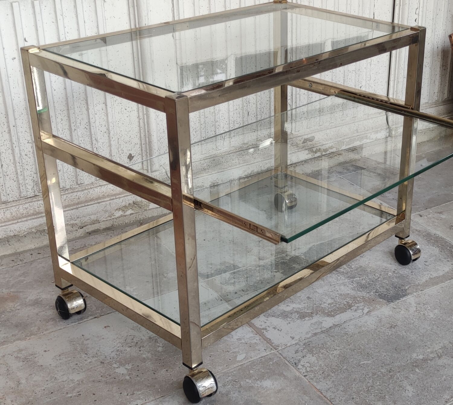 Rolling console service design / gold metal and glass