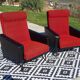 Vintage armchairs in red and black faux leather, the pair.